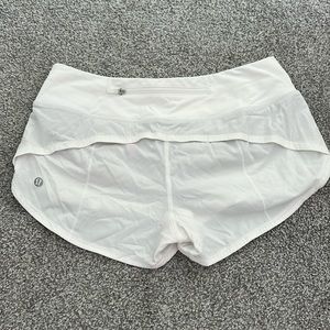 White Lululemon running shorts